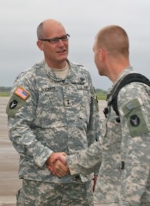Under overcast skies, a bright day for Minnesota Soldiers and families